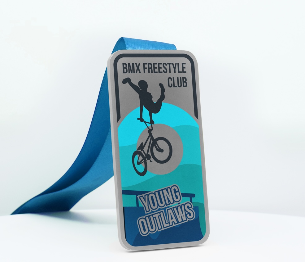 Rectangular kids BMX medal with freestyle rider silhouette and “Young Outlaws” design in blue tones.