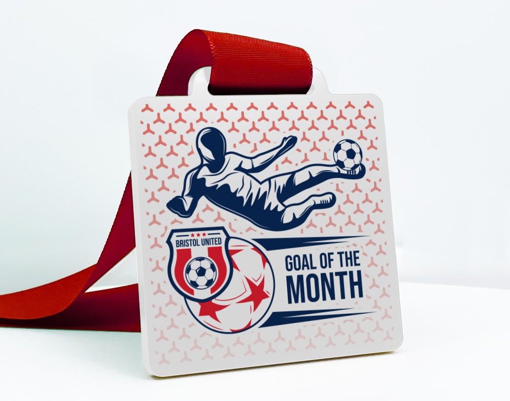 Custom football medal for kids featuring sliding player graphic and “Goal of the Month – Bristol United” text.